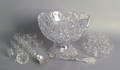 Cut glass punch bowl on stand with sterling ladle and associated punch cups