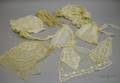 Three Embroidered Cotton and Lace House Caps Four Skirt Garnitures and a Pair of Net Gloves