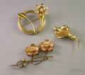 Three Gold Floral Brooches