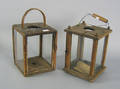 Two primitive pine lanterns