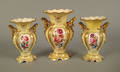 Three Vieux Paris pale yellow and gold porcelain mantle urns 19th c
