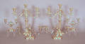 Two pair of silver plated candelabra