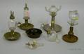 Six Colorless Glass Peg Lamps on Metal Candlestick Bases
