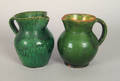 Two Pennsylvania green glazed redware pitchers 19th c