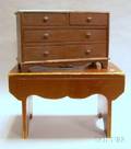Brownpainted Wooden Stool and a Miniature FourDrawer Chest