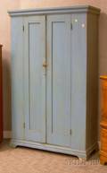 Bluepainted TwoDoor Paneled Cupboard with Bracket Base