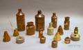 Ten Glazed Stoneware Inkwells and Seven Glazed Stoneware Master Inks and Bottles