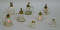 Eight Blown Colorless Bellform Glass Hand Lamps