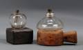 Two Glass Peg Lamps on Carved Wooden Bases