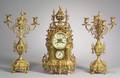 Threepiece French Brass Clock Garniture