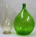 Large Green Molded Glass Demijohn and a Large Colorless Blown Glass Footed Bottle