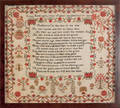 English silk on linen sampler dated 1817