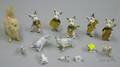 Fourteen Miniature Porcelain and Other Dog Figures