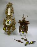 Black Forest Carved Walnut Wall BarometerThermometer and a Black Forest Carved Wooden Cuckoo Clock