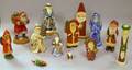 Thirteen Assorted Folkstyle Christmas Santa Figures