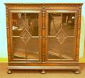 Continentalstyle Glazed Carved Walnut TwoDoor Book Cabinet