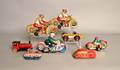 Four tin motorcycle wind up toys