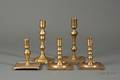Five Early Brass Candlesticks