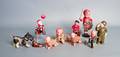 Nine celluloid and plastic wind up toys