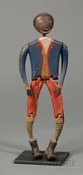 Articulated Carved and Painted Wooden Figure of a Black Man