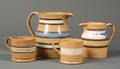 Two Yellowware Pitchers and Two Mugs