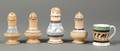 Four Pottery Pepper Pots and a Small Mochaware Mug
