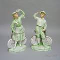 Pair of Heubach Bisque Figures Modeled as a Boy and Girl with Bicycles