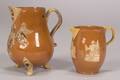 Two Staffordshire Orange Ground Earthenware Cream Jugs