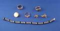 Three 14kt Gold Rings a Costume Paste and Glass Bracelet and a 14kt Gold Earring