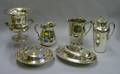 Silver Plated Cocktail Shaker Two Water Pitchers Two Covered Serving Dishes and a Trophy Champagne CoolerD
