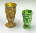 Glazed Stoneware Satyr Mask Footed Mug and a Green Glazed Staffordshire Satyr Mask Footed Mug