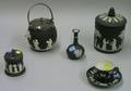 Wedgwood Black Jasper Dip and Solid Cup and Saucer Two Biscuit Barrels a Vase and a Jam Pot