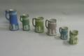 Six Wedgwood Jasper Jugs