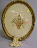 Oval Gilt Framed Embroidered Basket of Flowers and a Miniature Doll