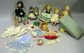 Four Hard Plastic Alexanderkins Outfits and Two Cloth Doll House Dolls