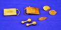Two 14kt Gold Monogrammed Belt Buckles Three Oval Monogrammed Tie Tacks and a Pair of Barbell form Cuff Links