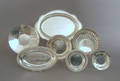 Seven sterling silver trays and plates