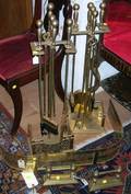 Pair of Brass Fire Tool Stands with Four Tools a Brass Fireplace Fender and a Pair of Tool Rests