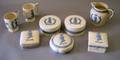 Eight Wedgwood Embossed Queens Ware Commemorative Items