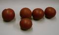Five Red Painted Wooden Game Balls