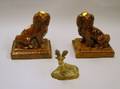 Small Painted Chalkware Recumbent Stag and a Pair of Glazed Redware Spaniels