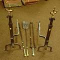 Pair of Brassmounted Wrought Iron Andirons and a Set of Three Brass and Iron Fireplace Tools