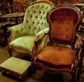 Two Victorian Rococo Revival Upholstered Carved Walnut Parlor Armchairs and a Footstool