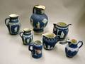 Seven Assorted Wedgwood Dark Blue Jasper Dip Jugs and Pitchers