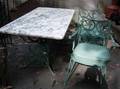 White Marbletop Painted Cast Iron Patio Table and a Pair of Armchairs