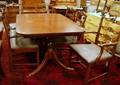Set of Eight Chippendalestyle Carved Mahogany Ribbonback Dining Chairs and a DoublePedestal Dining Table