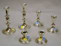 Two Pairs of Weighted Sterling Silver Candleholders and a Pair of Weighted Sterling Silver Candlesticks