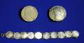Two European Silver Coins Mounted as Brooches and a French 1867 Twenty Centimes Bracelet
