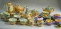 Four Japanese Iridescent Glazed Porcelain Partial Demitasse Tea and Luncheon Sets