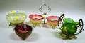 Four TurnoftheCentury Colored Art Glass Table Items